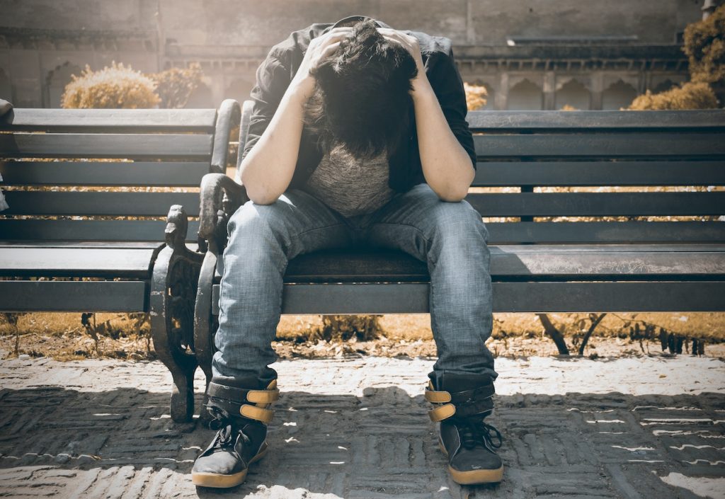 Boy sitting on a bench